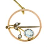 An early 20th century 9ct gold aquamarine and split pearl brooch.