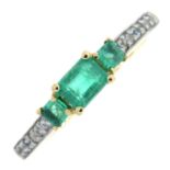 A 9ct gold emerald three-stone ring, with colourless gem sides.