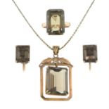 A set of smoky quartz jewellery, comprising a pendant with chain, a ring and a pair of earrings.