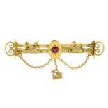 An early 20th century 15ct gold red paste bar brooch.