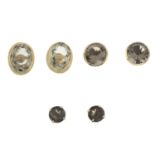 Three pairs of smoky quartz single-stone stud earrings.