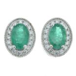 A pair of 18ct gold emerald and diamond cluster earrings.