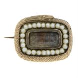 A Georgian gold and split pearl ouroboros snake memorial brooch.