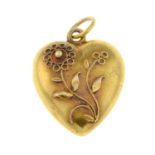 An Edwardian 15ct gold heart-shape floral pendant.