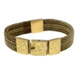 A mid Victorian woven hair bracelet, with gold engraved panel spacers and clasp.