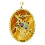 A cameo pendant, depicting two birds on a tree branch, with banded agate base and paste and opal