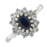 A silver sapphire and cubic zirconia cluster ring.
