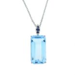 A rectangular-shape blue topaz pendant, with sapphire surmount, suspended from a chain.