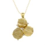 An 18ct gold rutilated quartz and diamond pendant, with chain.
