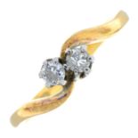 A mid 20th century 18ct gold and platinum brilliant-cut diamond two-stone crossover ring.