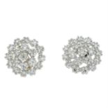 A pair of single-cut diamond earrings.
