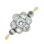 An early 20th century 18ct gold and platinum diamond floral cluster ring.