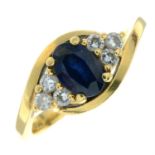 A sapphire crossover ring, with brilliant-cut diamond trefoil sides.