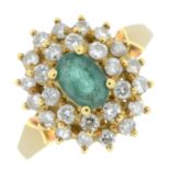 An 18ct gold emerald and diamond cluster ring.