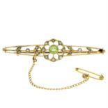 An early 20th century 9ct gold peridot and split pearl brooch.