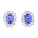 A pair of 18ct gold tanzanite and diamond cluster earrings.