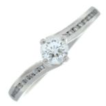 A brilliant-cut diamond single-stone ring, with brilliant-cut diamond shoulders.