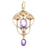 An early 20th century 9ct gold amethyst floral pendant, by Murrle Bennett & Co.