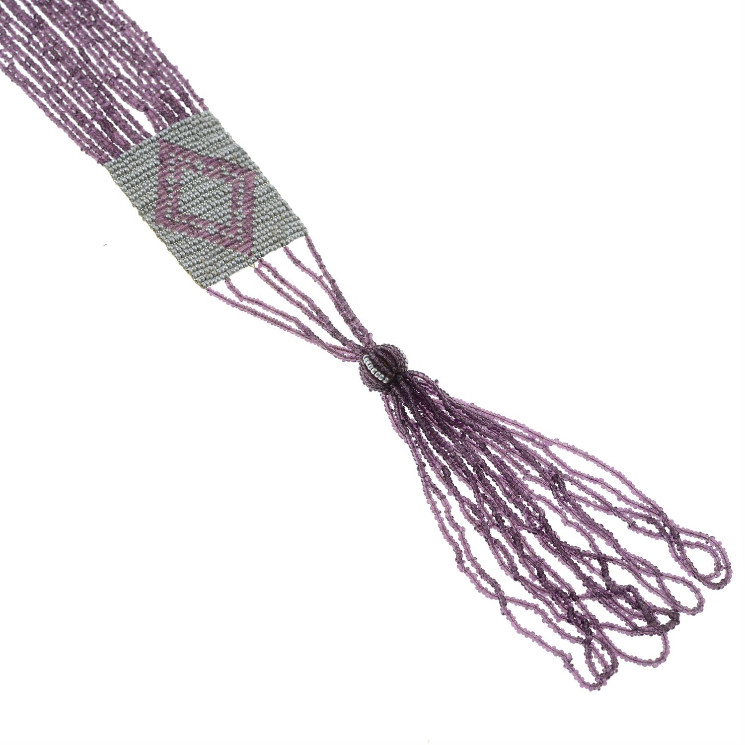 An early 20th century beaded paste tassel necklace. - Image 2 of 2