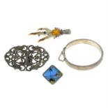 Four items of mid 20th century and later silver jewellery, to include a 1950's engraved bangle.