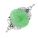 A jade cabochon and vari-cut diamond dress ring.