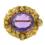 An early to mid 19th century gold amethyst cannetille brooch.