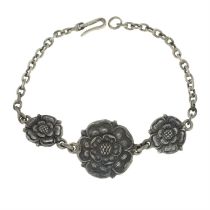 A Tudor rose bracelet.