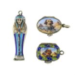 Three early 20th century Egyptian silver enamel charms, to include two Moses basket charms,