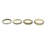 Four mid 20th century 9ct gold and silver, paste full eternity rings.