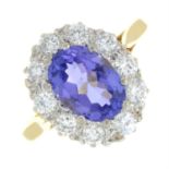 An 18ct gold tanzanite and brilliant-cut diamond cluster ring.