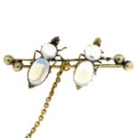 An early 20th century moonstone insect bar brooch.