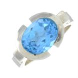 A silver blue topaz ring.