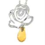 An 18ct gold diamond openwork rose pendant, on trace-link chain with a citrine drop.