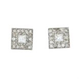 A pair of vari-cut diamond cluster earrings.