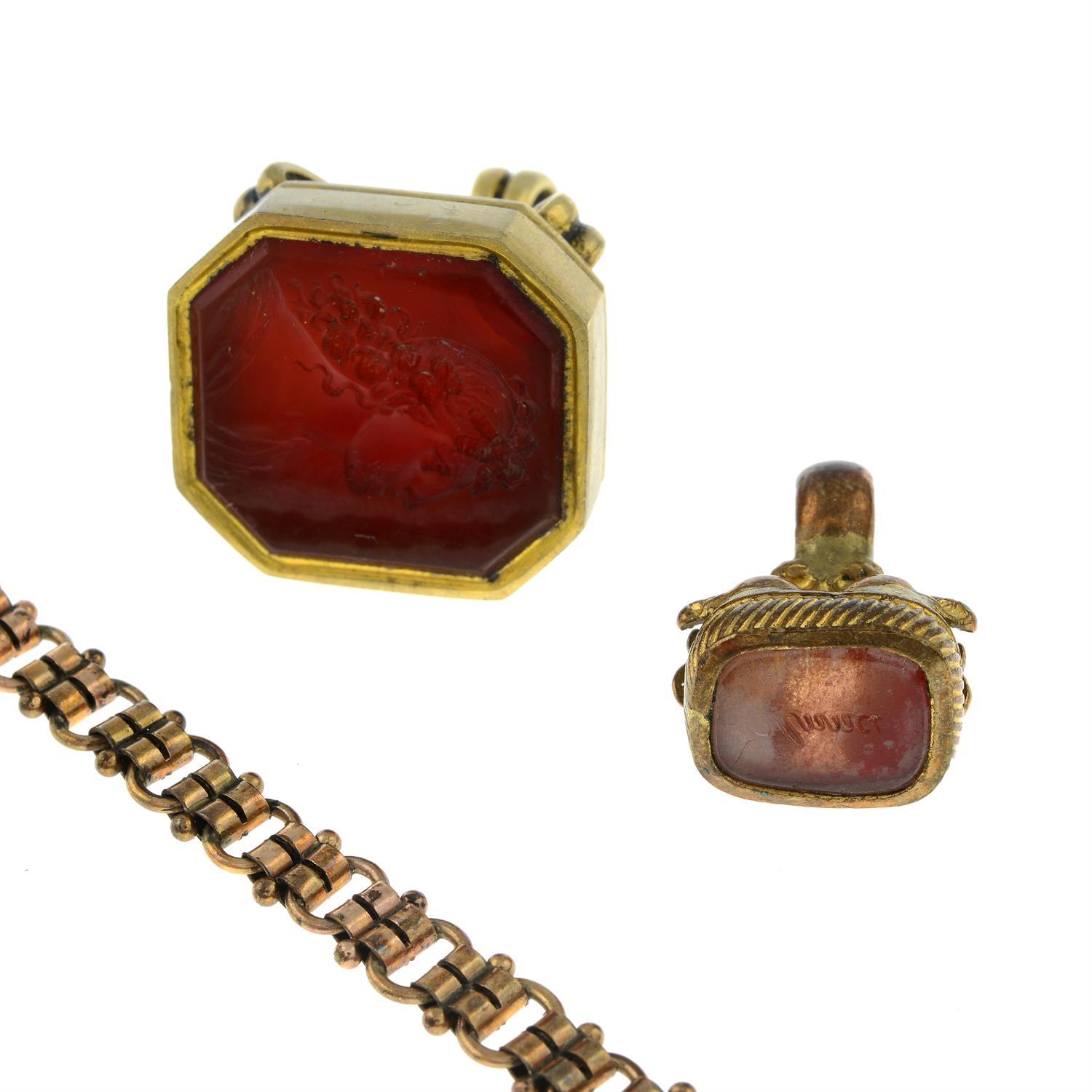 Four items of late Victorian jewellery, to include two carved seal fobs, a longuard chain and a - Image 2 of 3