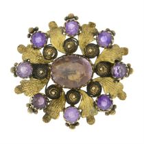 An early to mid 19th century gold foil-back amethyst foliate cannetille brooch.