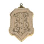 A late Victorian locket pendant, with foliate motif.