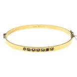 A 9ct gold gem-set 'Dearest' bangle.