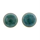 A pair of green paste stud earrings.