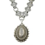 A late Victorian silver locket pendant, with fancy-link chain.