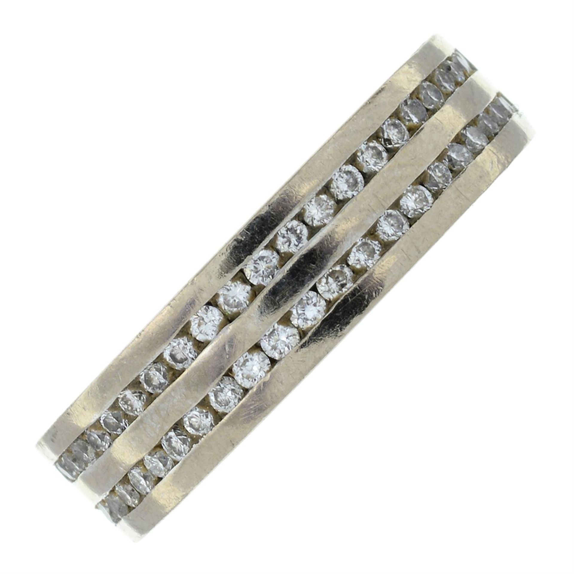 An 18ct gold brilliant-cut diamond two-row half-eternity ring.