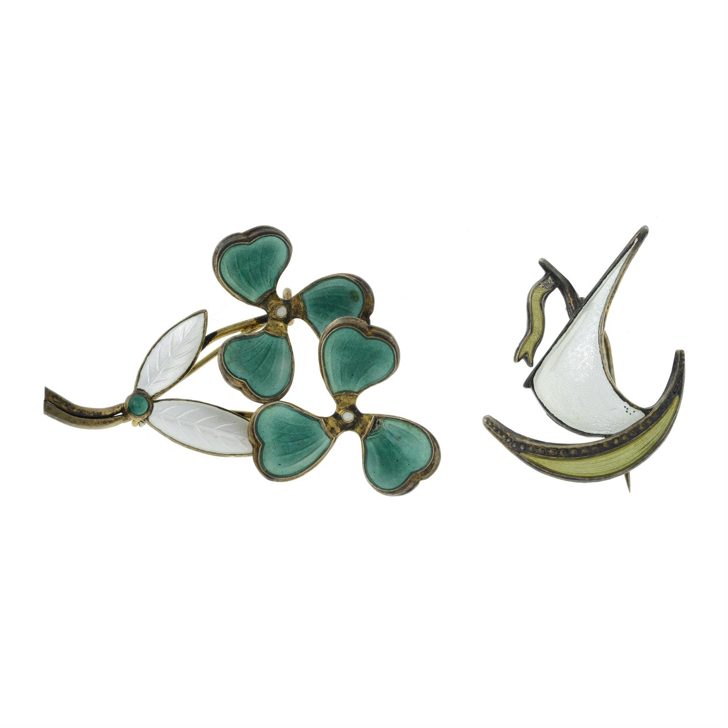 Two early 20th century silver and enamel brooches.