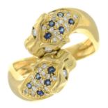 An 18ct gold sapphire and brilliant-cut diamond ring, depicting two leopard heads.