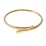 An early 20th century 9ct gold snake large bangle.