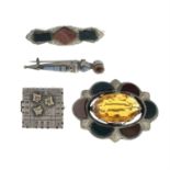 Four late Victorian to Edwardian silver brooches, to include three Scottish agate brooches.