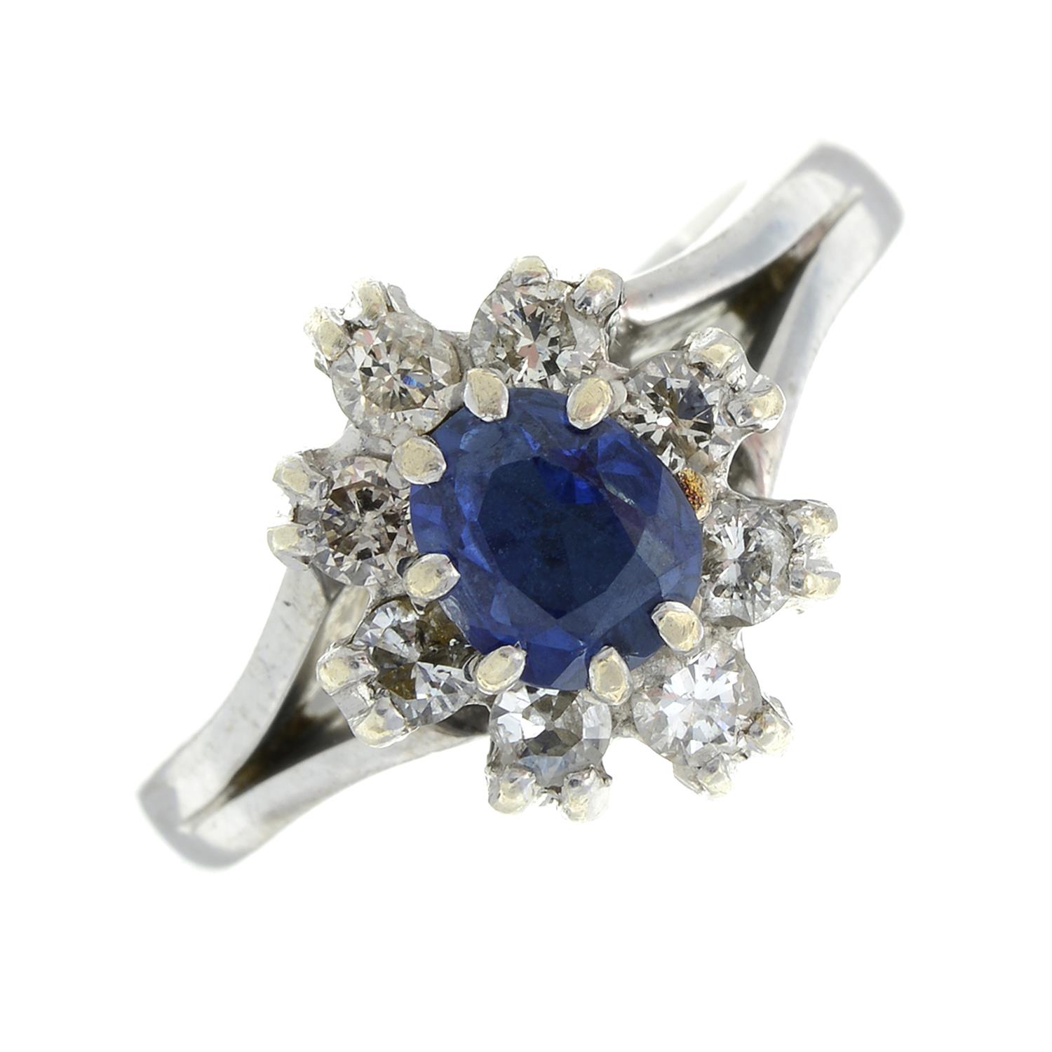 A sapphire and brilliant-cut diamond cluster ring.