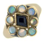 An opal and blue paste cluster ring.