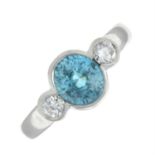 An 18ct gold blue zircon and brilliant-cut diamond three-stone ring.