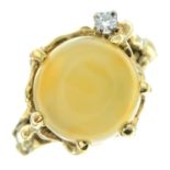 A chrysoberyl cats-eye cabochon and brilliant-cut diamond accent abstract dress ring.