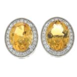 A pair of 18ct gold citrine and brilliant-cut diamond cluster earrings.